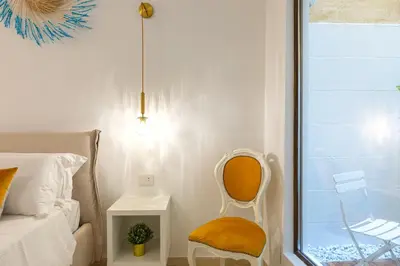 Letto o letti in una camera di CagliariExclusive Marina