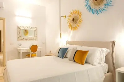 Letto o letti in una camera di CagliariExclusive Marina