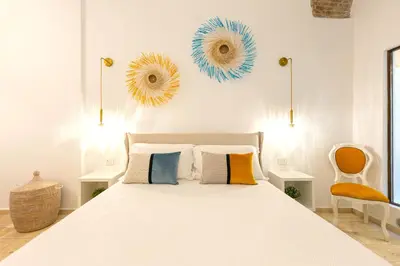 Letto o letti in una camera di CagliariExclusive Marina