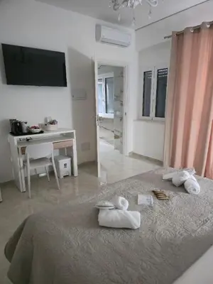 Letto o letti in una camera di La Piuma Cagliari