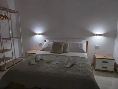 Letto o letti in una camera di La Piuma Cagliari