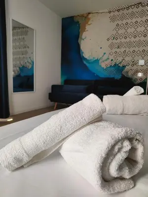 Letto o letti in una camera di Iglesias Centro Apartments In Sardinia