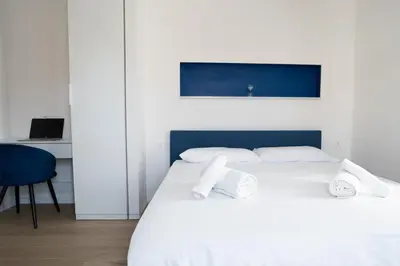 Letto o letti in una camera di Iglesias Centro Apartments In Sardinia