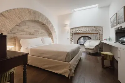 Letto o letti in una camera di Il Gallo Bianco