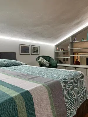 Letto o letti in una camera di La Mansardina