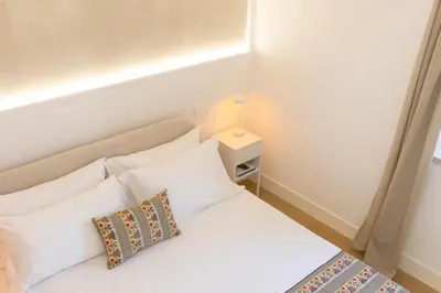 Letto o letti in una camera di Sant'Elena Rooms