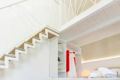 Letto o letti in una camera di Sant'Elena Rooms
