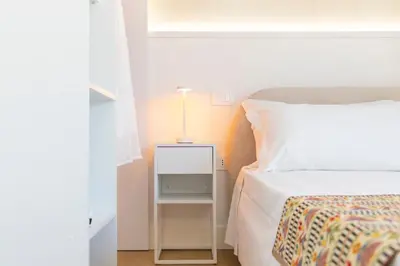 Letto o letti in una camera di Sant'Elena Rooms