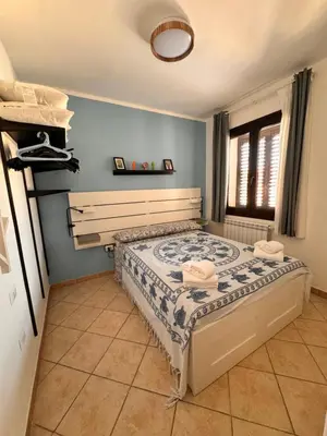 Letto o letti in una camera di Casa Agata - La Casa in Sardegna