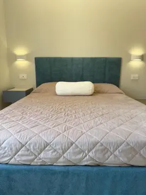 Letto o letti in una camera di Suite Mameli