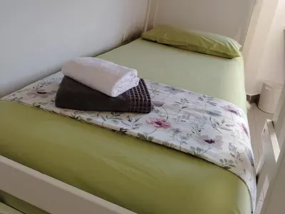 Letto o letti in una camera di Casa del Minatore