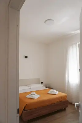 Letto o letti in una camera di Casa Marianna