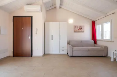 Area soggiorno di Domu Balilla Cozy Loft with a panoramic terrace