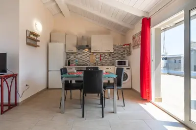 Cucina o angolo cottura di Domu Balilla Cozy Loft with a panoramic terrace