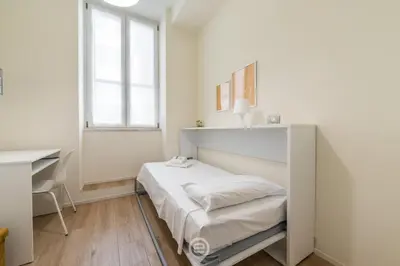 Letto o letti in una camera di Maison Galilei