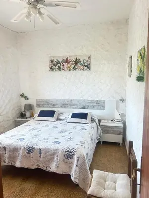 Letto o letti in una camera di Terrace with dreamy sunset Cala Sapone