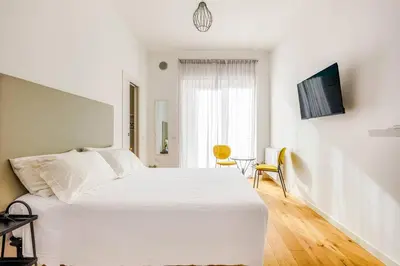 Letto o letti in una camera di Beija Flor Rooms Cagliari