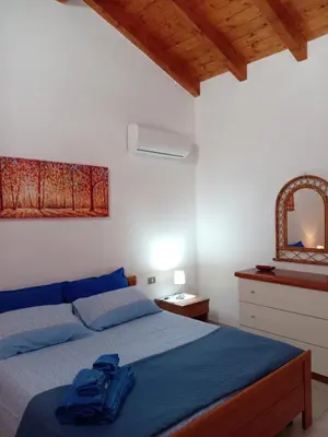 Letto o letti in una camera di Casa Caterina