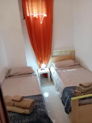 Letto o letti in una camera di Casa Caterina