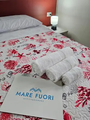 Letto o letti in una camera di Mare Fuori