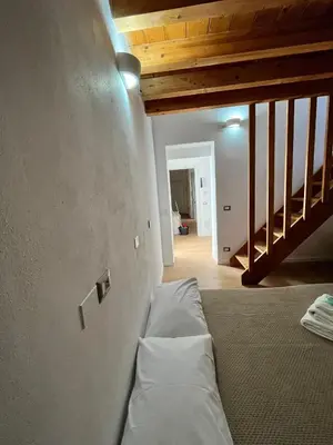 Letto o letti in una camera di WHITE MOON CAGLIARI via Dettori 5 Centro