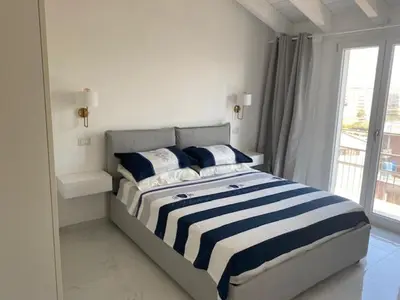 Letto o letti in una camera di Appartamento pari ad una Suite