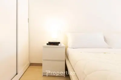 Letto o letti in una camera di The White Loft by Propertize