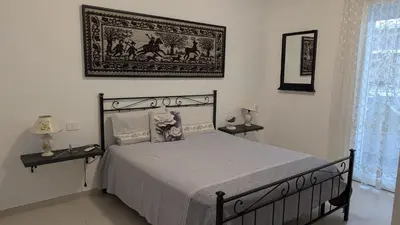 Letto o letti in una camera di Domu S'Aratzia - Vicino al mare - con parcheggio privato