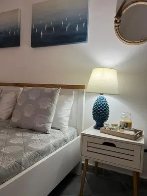 Letto o letti in una camera di AcquaChiara casa vacanza