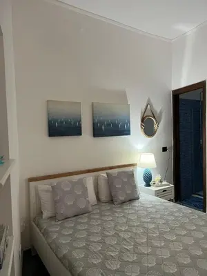 Letto o letti in una camera di AcquaChiara casa vacanza