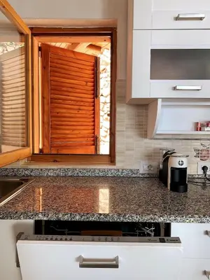 Cucina o angolo cottura di Cozy flat stunning sea view, 10' from Chia beaches