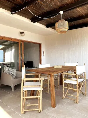 Area soggiorno di Cozy flat stunning sea view, 10' from Chia beaches