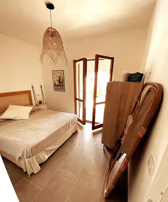 Letto o letti in una camera di Cozy flat stunning sea view, 10' from Chia beaches
