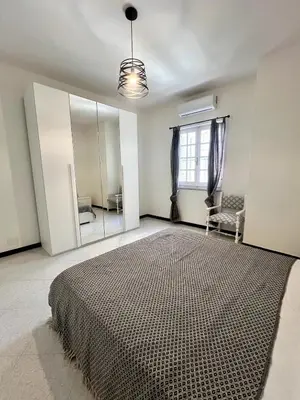 Letto o letti in una camera di Lemon Tree House nahe Sant Antioco & Kitespot