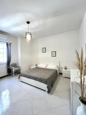 Letto o letti in una camera di Lemon Tree House nahe Sant Antioco & Kitespot