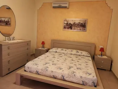 Letto o letti in una camera di Villa Manuela