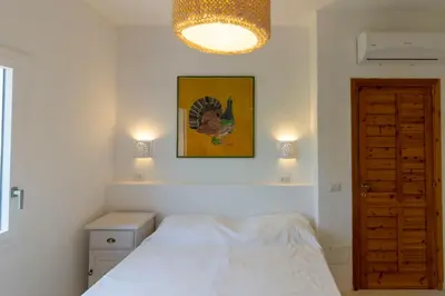 Letto o letti in una camera di Villa Tuna