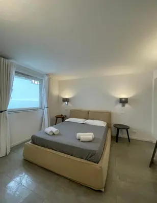 Letto o letti in una camera di Libeccio Apartment, Rosa dei Venti, Perla Marina