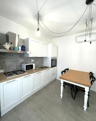 Cucina o angolo cottura di Libeccio Apartment, Rosa dei Venti, Perla Marina