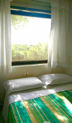 Letto o letti in una camera di Maestrale Apartment, Rosa dei Venti, Perla Marina