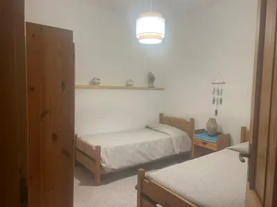 Letto o letti in una camera di Appartamento fronte spiaggia
