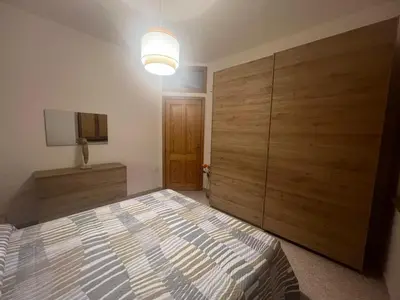 Letto o letti in una camera di Appartamento fronte spiaggia