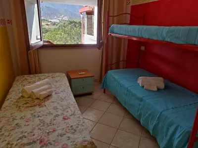 Letto o letti in una camera di Orizzonte Sardo