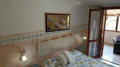 Letto o letti in una camera di Orizzonte Sardo