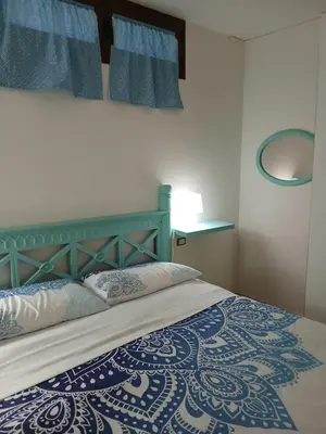 Letto o letti in una camera di La Fillirea