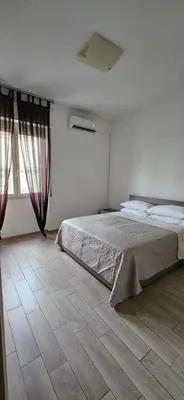 Letto o letti in una camera di Cagliariparadiseapartments it Cicala