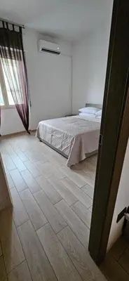 Letto o letti in una camera di Cagliariparadiseapartments it Cicala