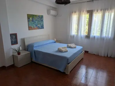 Letto o letti in una camera di Casa MAM