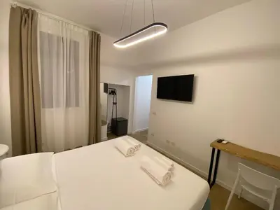 Letto o letti in una camera di Palazzo Cavour Rooms & Breakfast