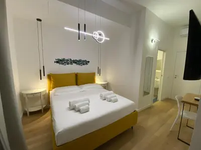 Letto o letti in una camera di Palazzo Cavour Rooms & Breakfast